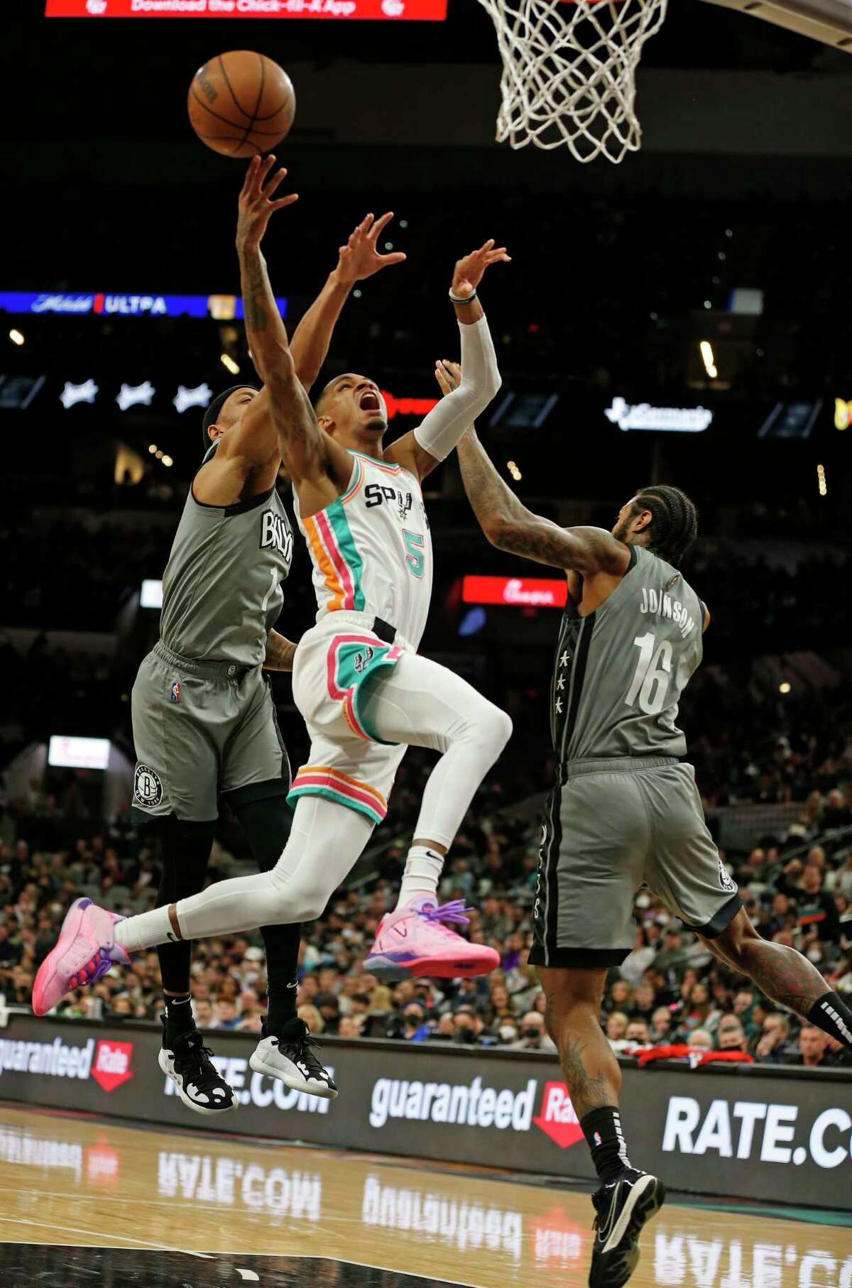 Dejounte Murray, center, had 25 points, 12 rebounds and 10 assists in Friday’s loss for his 13th career triple-double.