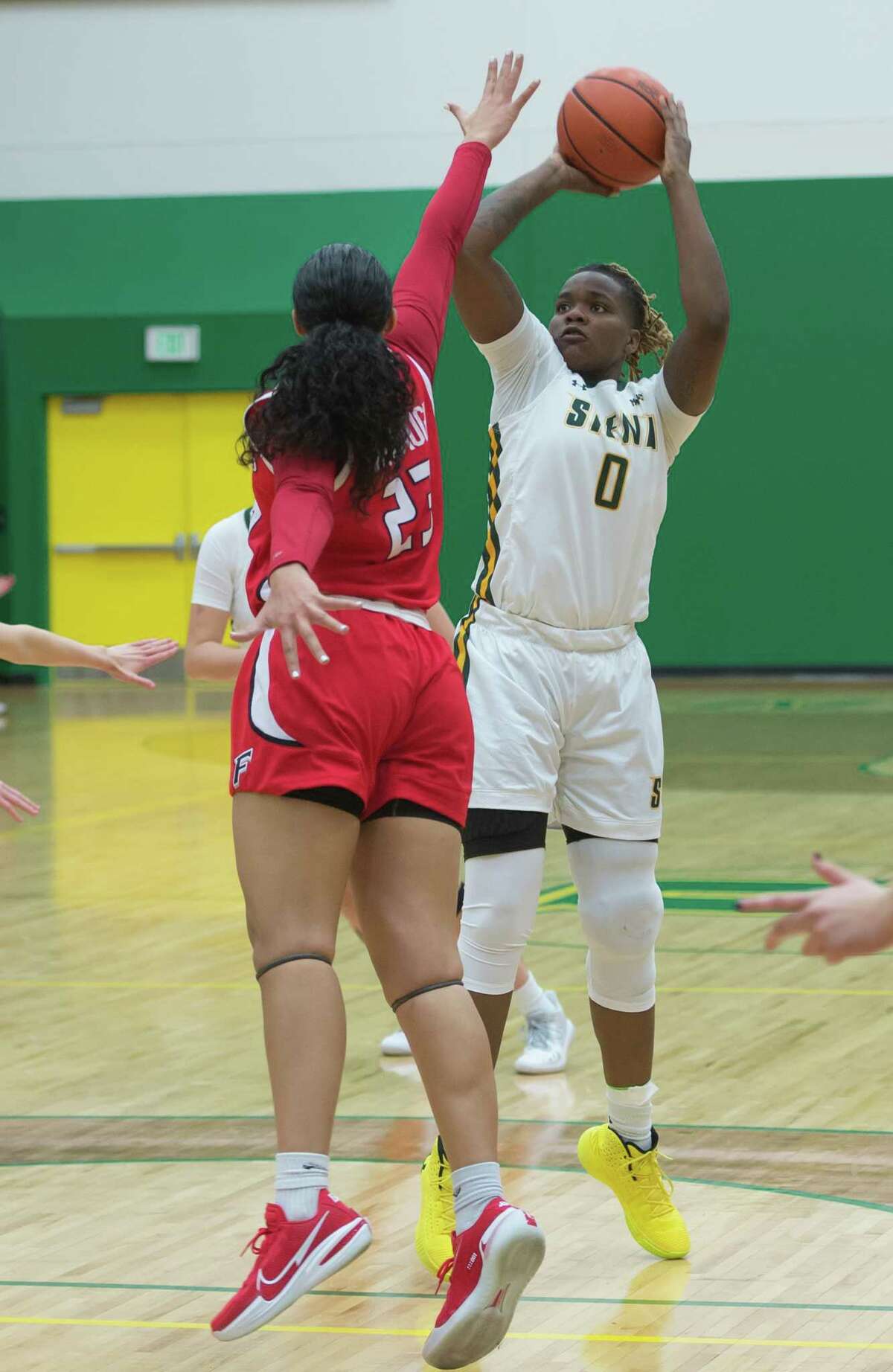 Siena forward Selena Philoxy, right, shown in a game last month, had a double-double in the Saints' Senior Day win over Marist.