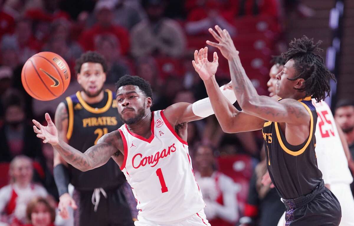 Houston Cougars guard Jamal Shead (1) chases after a loose ball against East Carolina Pirates at the Fertitta Center in Houston on Saturday, Jan. 22, 2022.