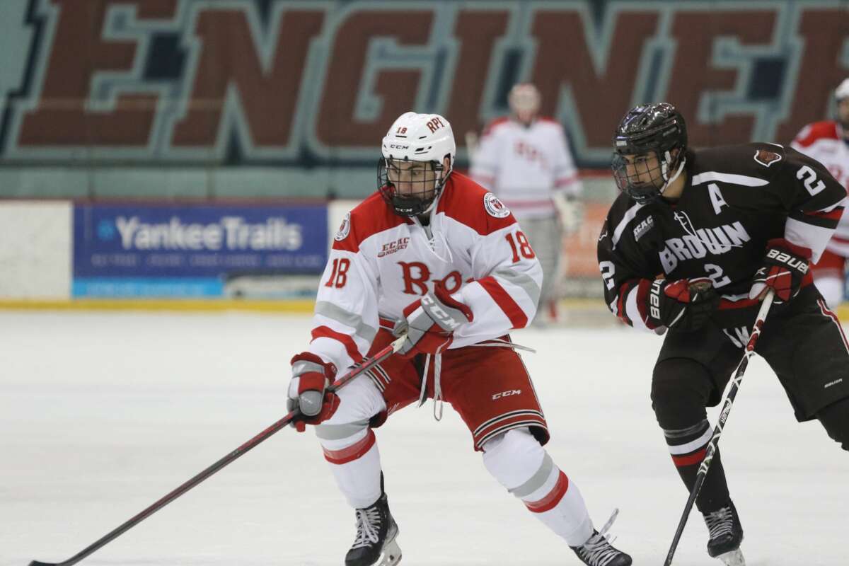 RPI's Jakob Lee, left, moves the puck as Brown's Luke Krys closes in during their game on Saturday, Jan. 22, 2022, at Houston Field House. Lee played center and wing in the exhibition games.