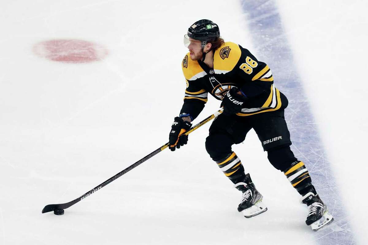 Boston Bruins' David Pastrnak plays against the Winnipeg Jets during the second period of an NHL hockey game, Saturday, Jan. 22, 2022, in Boston. (AP Photo/Michael Dwyer)