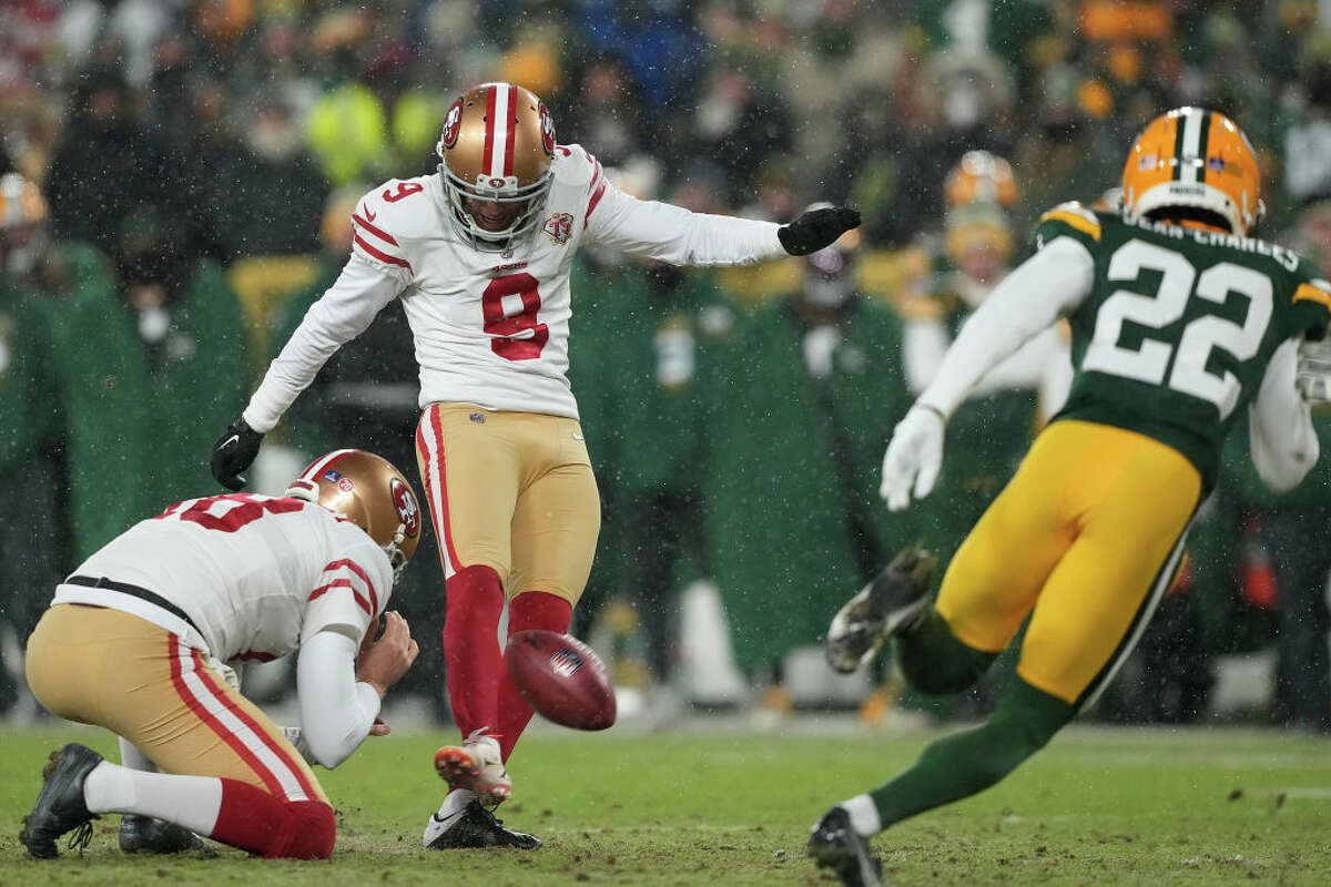 Kicker Robbie Gould of the San Francisco 49ers kicks an extra point during the fourth quarter of the NFC Divisional Playoff game against the Green Bay Packers at Lambeau Field on Jan. 22, 2022 in Green Bay, Wis.