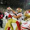 Kicker Robbie Gould gets a lift after his 45-yard field goal as time expired sent the 49ers to the NFC Championship Game.
