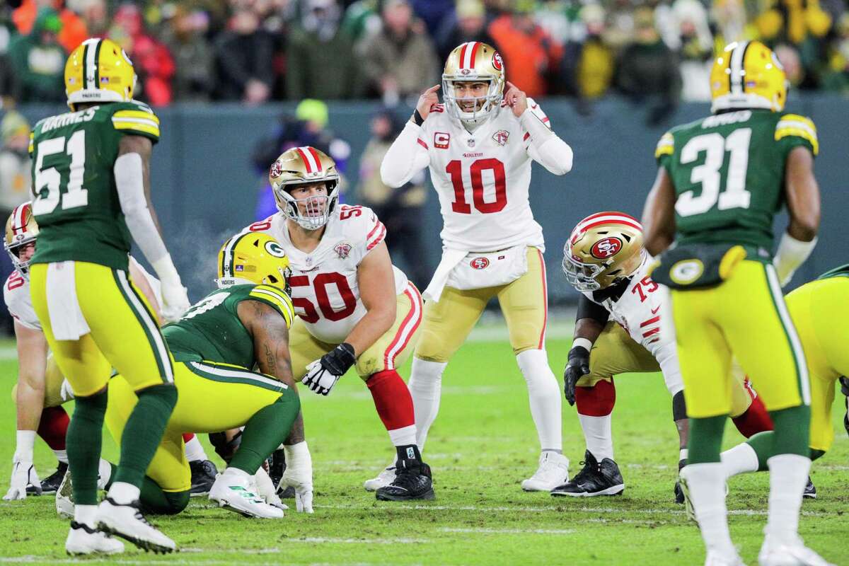 San Francisco 49ers quarterback Jimmy Garoppolo (10) calls an audible as the San Francisco 49ers play the Green Bay Packers in the NFL Divisional Round playoff game at Lambeau Field in Green Bay, Wis., on Saturday, January 22, 2022.