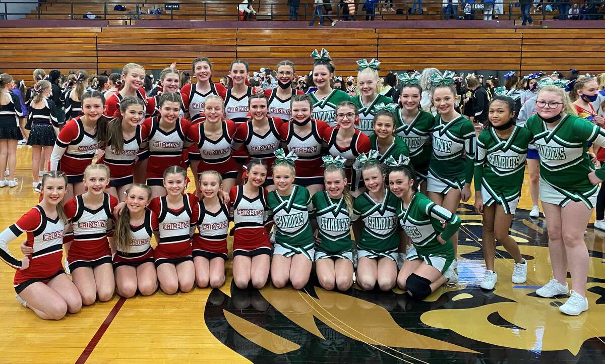 Jacksonville Middle School and Our Saviour School cheerleaders pose for a photo at the Illinois Elementary School Association Cheer Championship at Peoria High School on Saturday.
