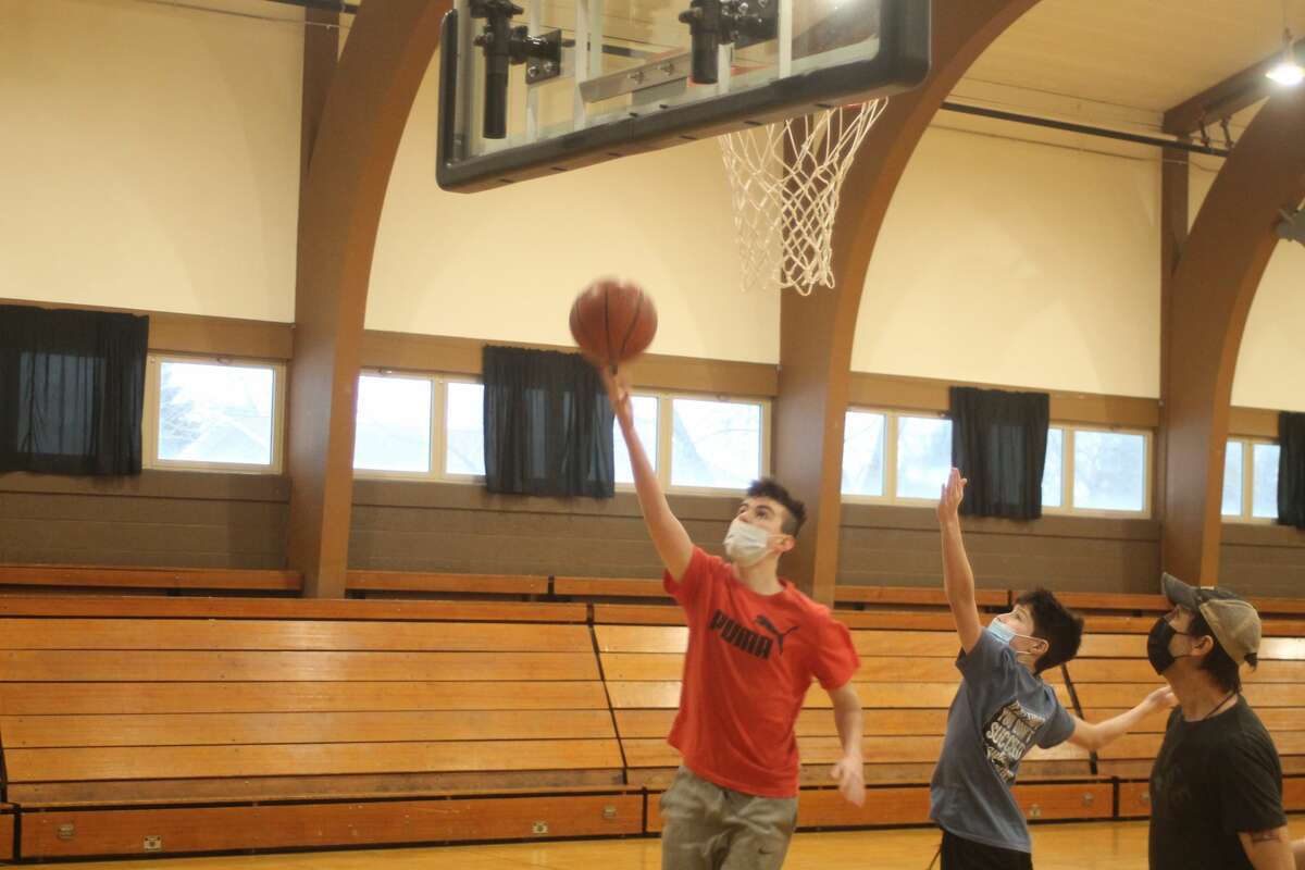 A game of pickup basketball takes place during the Armory Youth Project's open gym. Basketball open gym is planned throughout this month at the Armory Youth Project, 555 First St. in Manistee.
