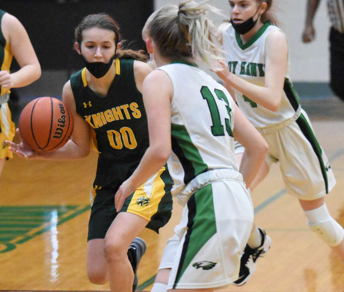 Metro-East Lutheran's Sarah Huber races the ball up the court during the first half against Carrollton on Saturday in Carrollton.