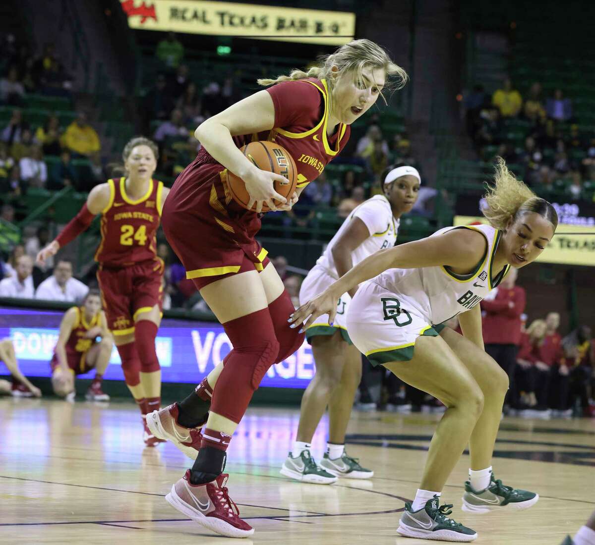 Iowa State forward Morgan Kane, left, pulls down a rebound over Baylor guard Jaden Owens, right, in the first half of an NCAA college basketball game, Sunday, Jan. 23, 2022, in Waco, Texas. (Rod Aydelotte/Waco Tribune-Herald via AP)