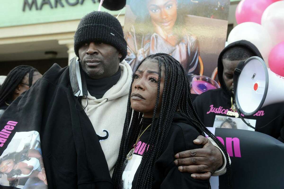 Everett Smith and Shantell Fields, Lauren Smith-Fields’ parents, stands stand together during a protest rally in front of the Morton Government Center, in Bridgeport, Conn. Jan. 23, 2022. Smith-Fields was found dead in her Bridgeport apartment in December and her family and friends marched in her memory on Sunday, which would have been her 24th birthday.