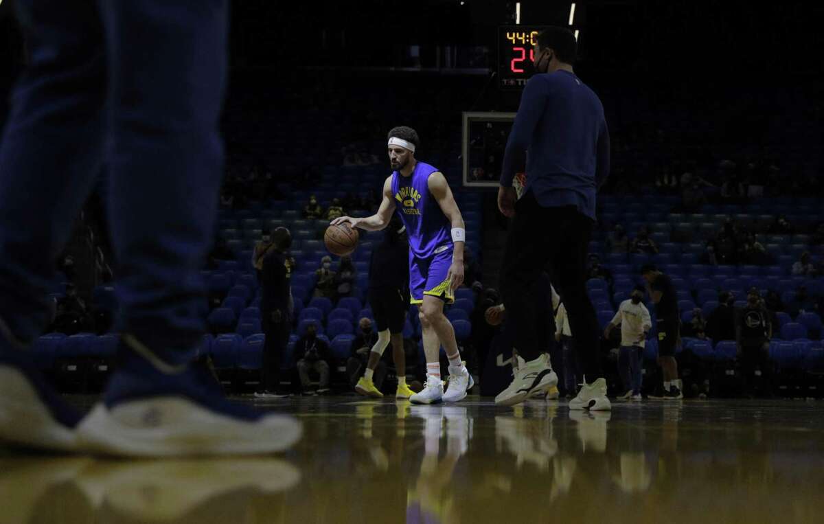 Klay Thompson (11) warms up before the Golden State Warriors played the Indiana Pacers at Chase Center in San Francisco, Calif., on Thursday, January 20, 2022.