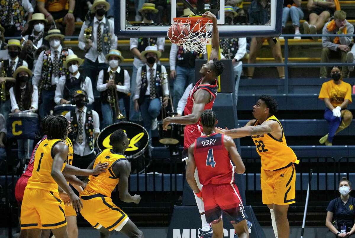 Arizona center Christian Koloko dunks against California forward Andre Kelly (22) during the second half of their game at Haas Pavilion. Koloko had 19 points, 13 rebounds and three blocks.