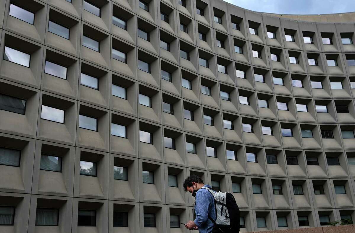 A pedestrian walks near the Department of Housing and Urban Development on May 17, 2021, in Washington, D.C.