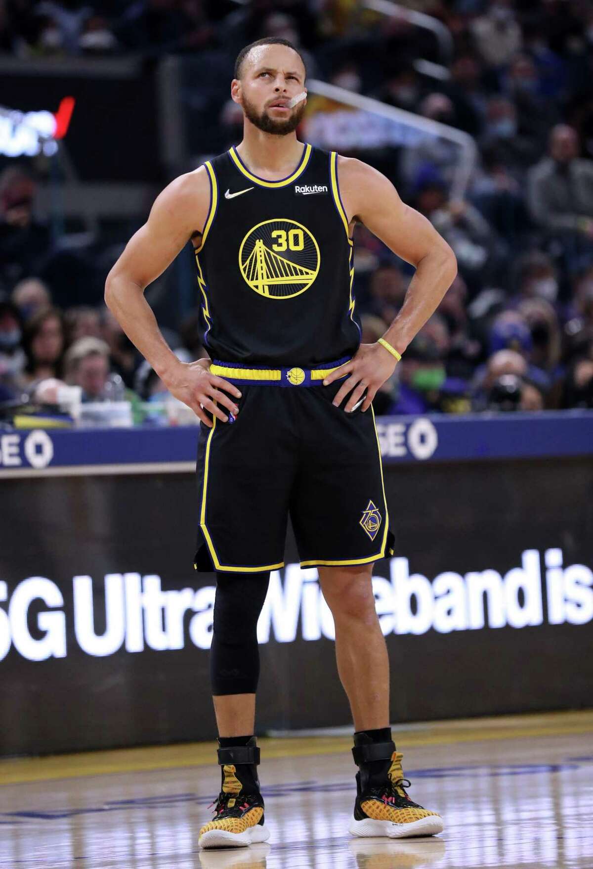 Golden State Warriors' Stephen Curry squints during 1st quarter against Utah Jazz during NBA game in San Francisco, Calif., on Sunday, January 23, 2022.