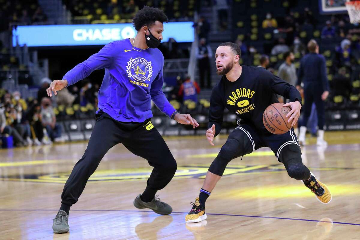 Golden State Warriors' Stephen Curry goes through his pre-game routine with Leandro Barbosa before playing Utah Jazz during NBA game in San Francisco, Calif., on Sunday, January 23, 2022.