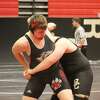 Reed City's Wyatt Spalo (left) works against his opponent in Saturday's Reed City Invitational.