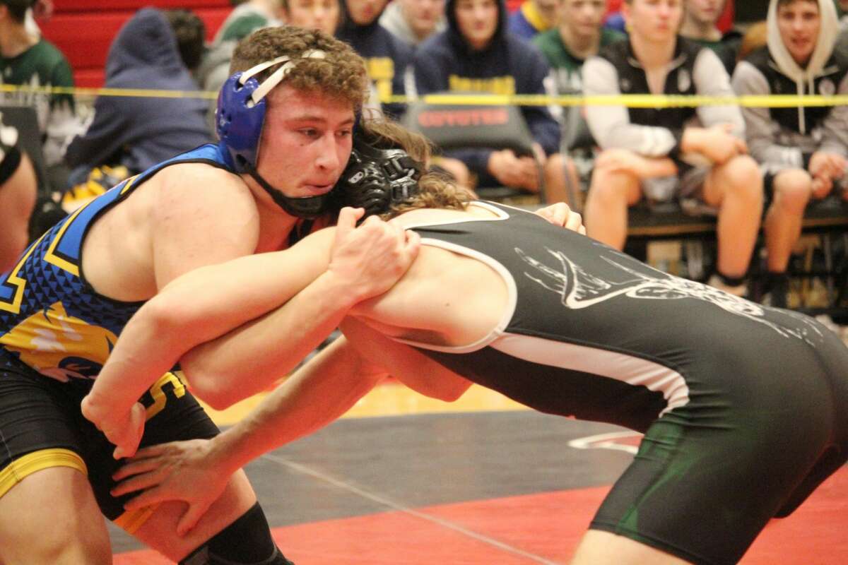 Evart's Cole Hopkins (left) remains undefeated on the season.