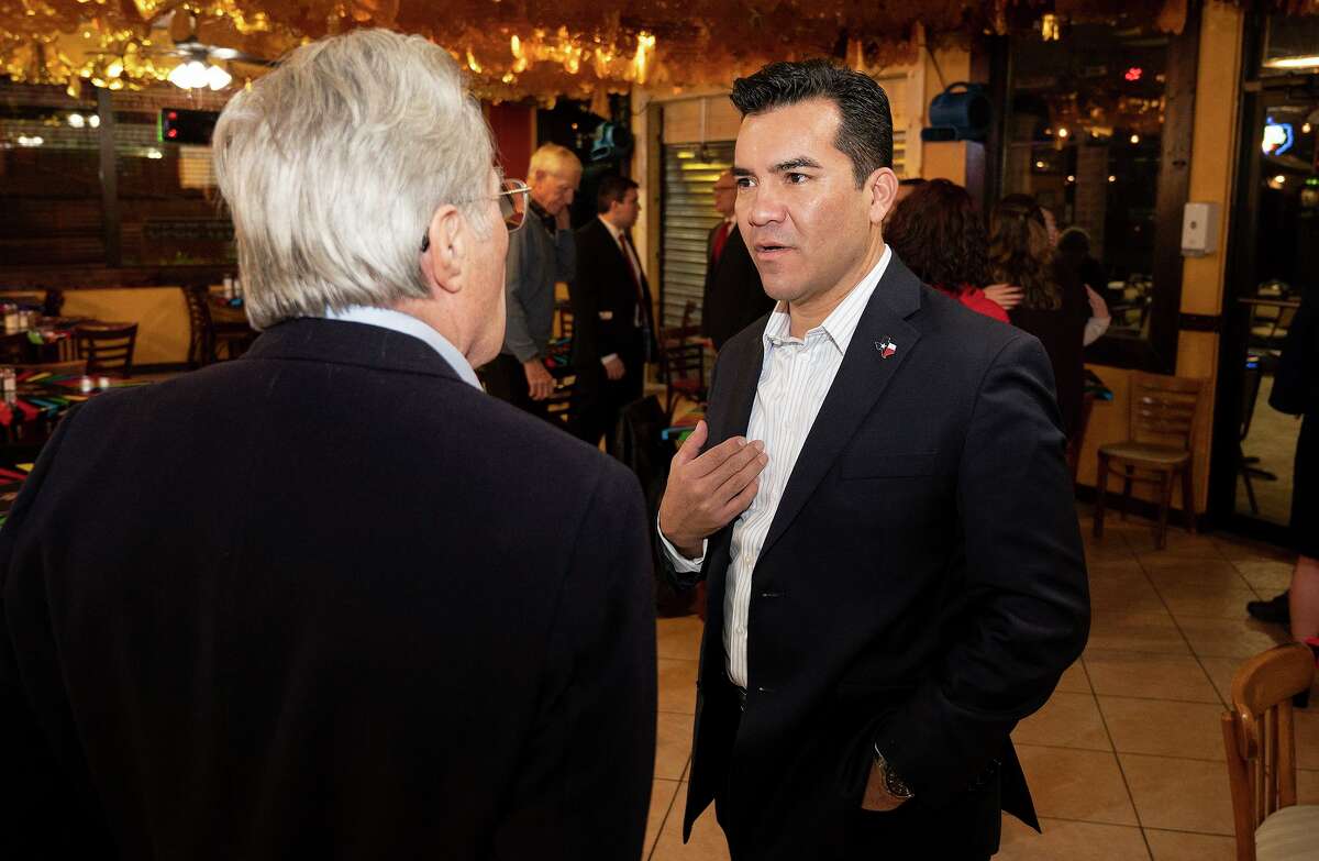 Candidate for Texas Land Commissioner Victor Avila speaks with voters, Saturday, Jan. 22, 2022 at Mi Tierra Cafe during a meet and greet.