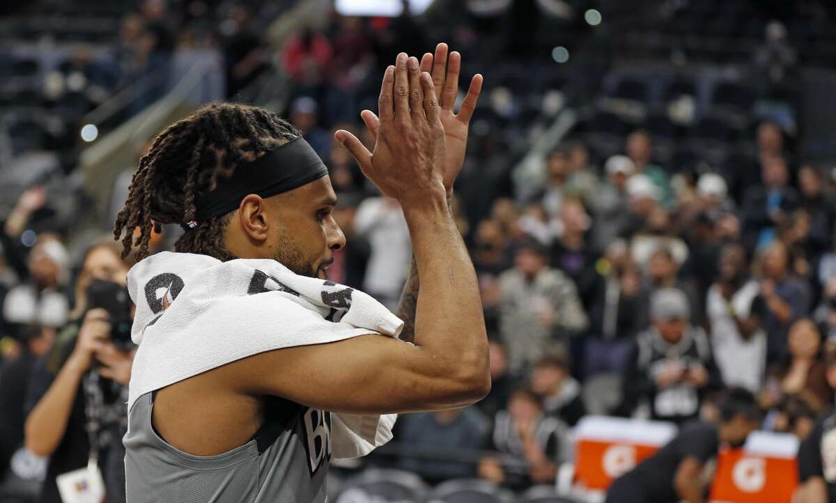 SAN ANTONIO, TX - JANUARY 21: Patty Mills #8 of the Brooklyn Nets acknowledges San Antonio Spurs fans at the end of their game at AT&T Center on January 21, 2022 in San Antonio, Texas.