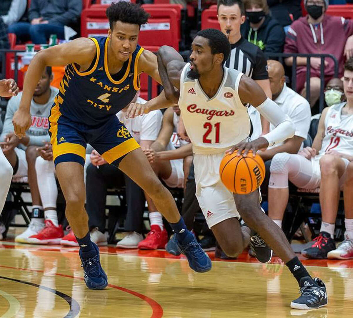 SIUE's Shaun Doss Jr. (21) drives against a Kansas City defender in a game earlier this season in Edwardsville. Doss had nine points in the Cougars' loss Saturday at Morehead State.