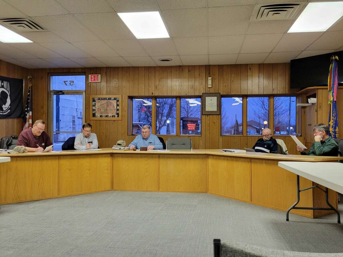 The Oliver Township planners talk during their meeting last week, where they approved a medical marijuana ordinance for the township. 