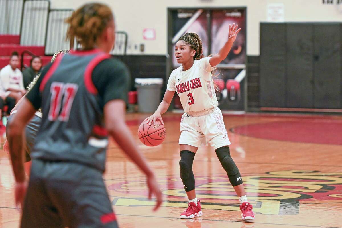 Langham Creek’s Aniyah Sanford looks to make a play for her team during a preseason basketball game. The Lady Lobos are unbeaten in league play, as of Jan. 19, and in sole possession of first place heading in the second round of District 16-6A.