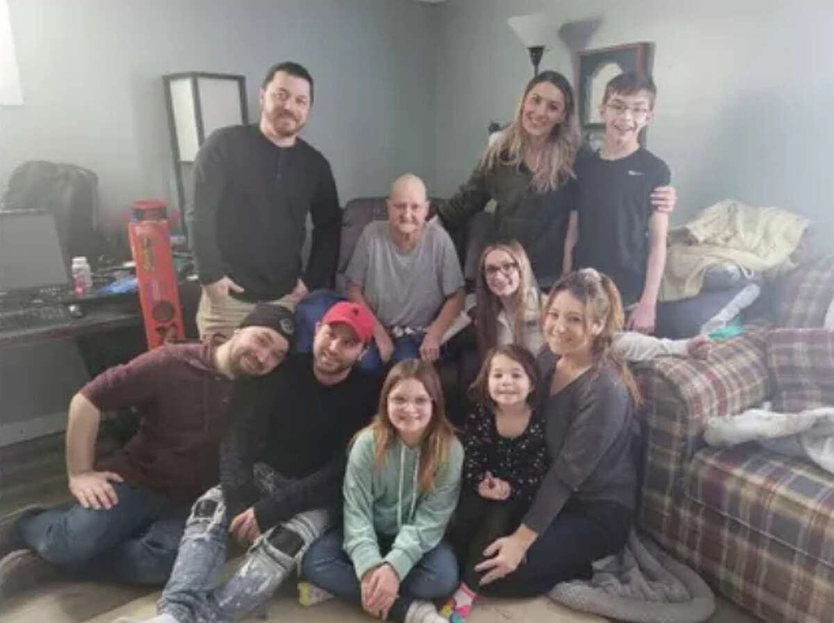 Tina Jackson, center, surrounded by her children and grandchildren. Tina is currently in hospice care after battling cancer over seven years that has become terminal.