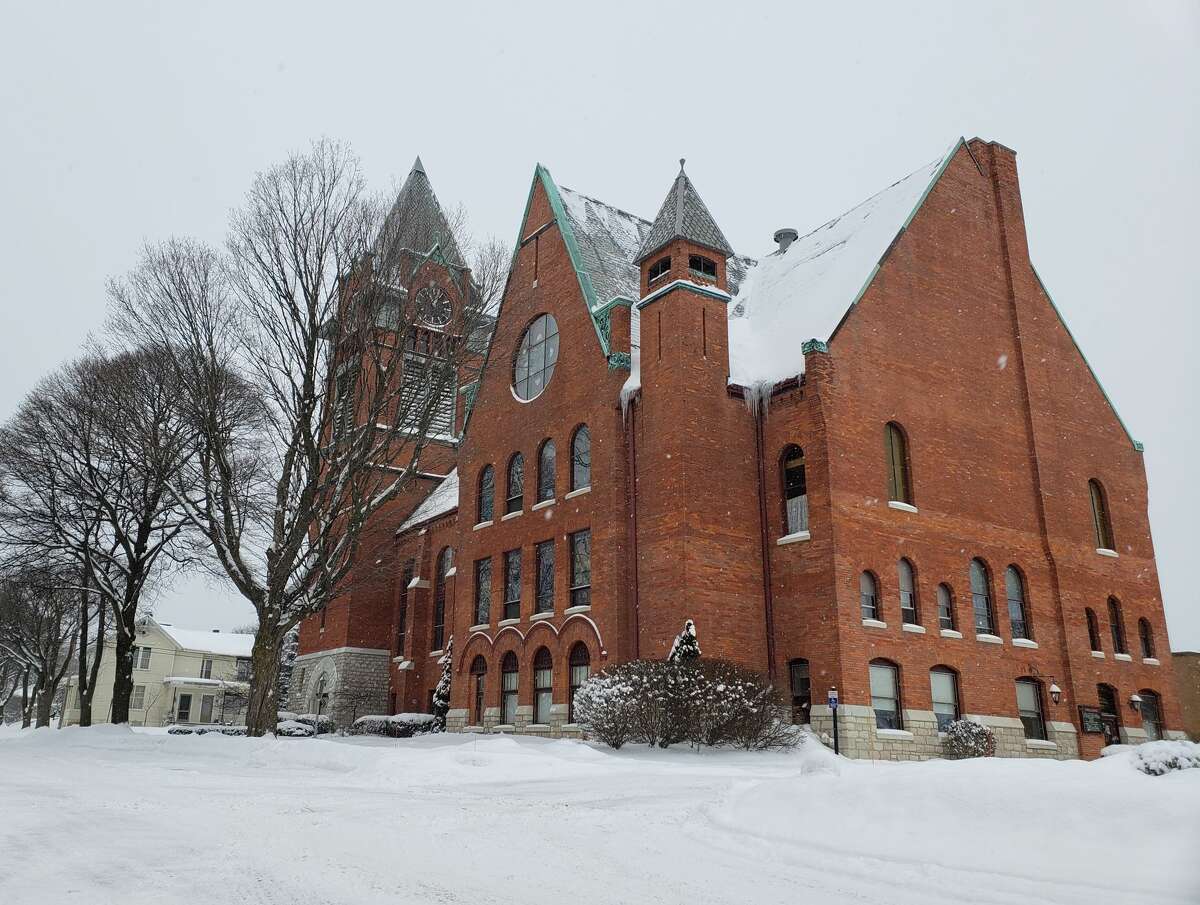 Manistee First Congressional Church  was framed in clouds of snow above and pillows of snow on the ground on Monday. 