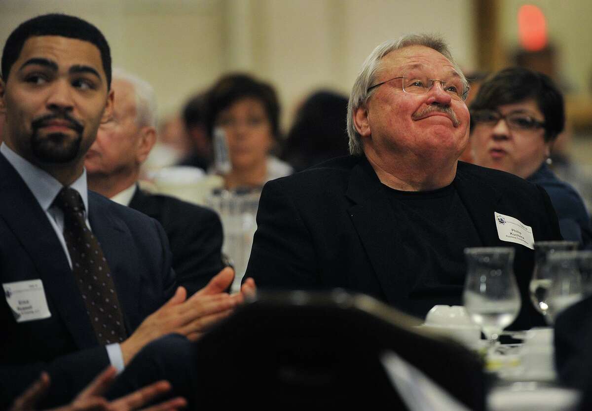 Real estate developer Phil Kuchma, right, listens to Bridgeport Mayor Joe Ganim's annual State of the City speech to members of the business community at the Holiday Inn in Bridgeport, Conn. on Wednesday, April 4, 2018.