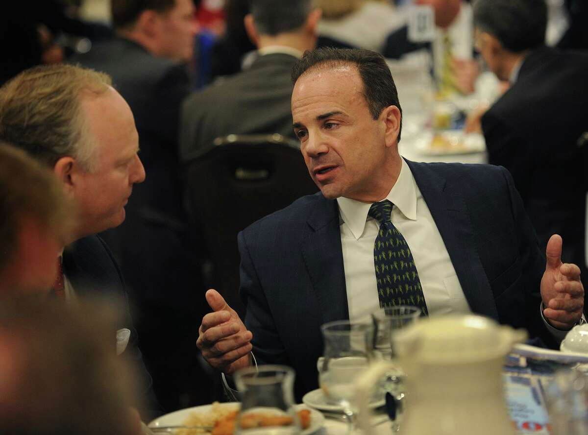 Bridgeport Mayor Joe Ganim, right, chats with Jeffrey Klaus from Webster Bank before delivering the annual State of the City speech to members of the business community at the Holiday Inn in Bridgeport, Conn. on Wednesday, April 4, 2018.