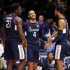 UConn’s Tyrese Martin (4), celebrates with teammates Adama Sanogo, left, and Tyler Polley during Thursday’s win at Butler in Indianapolis.
