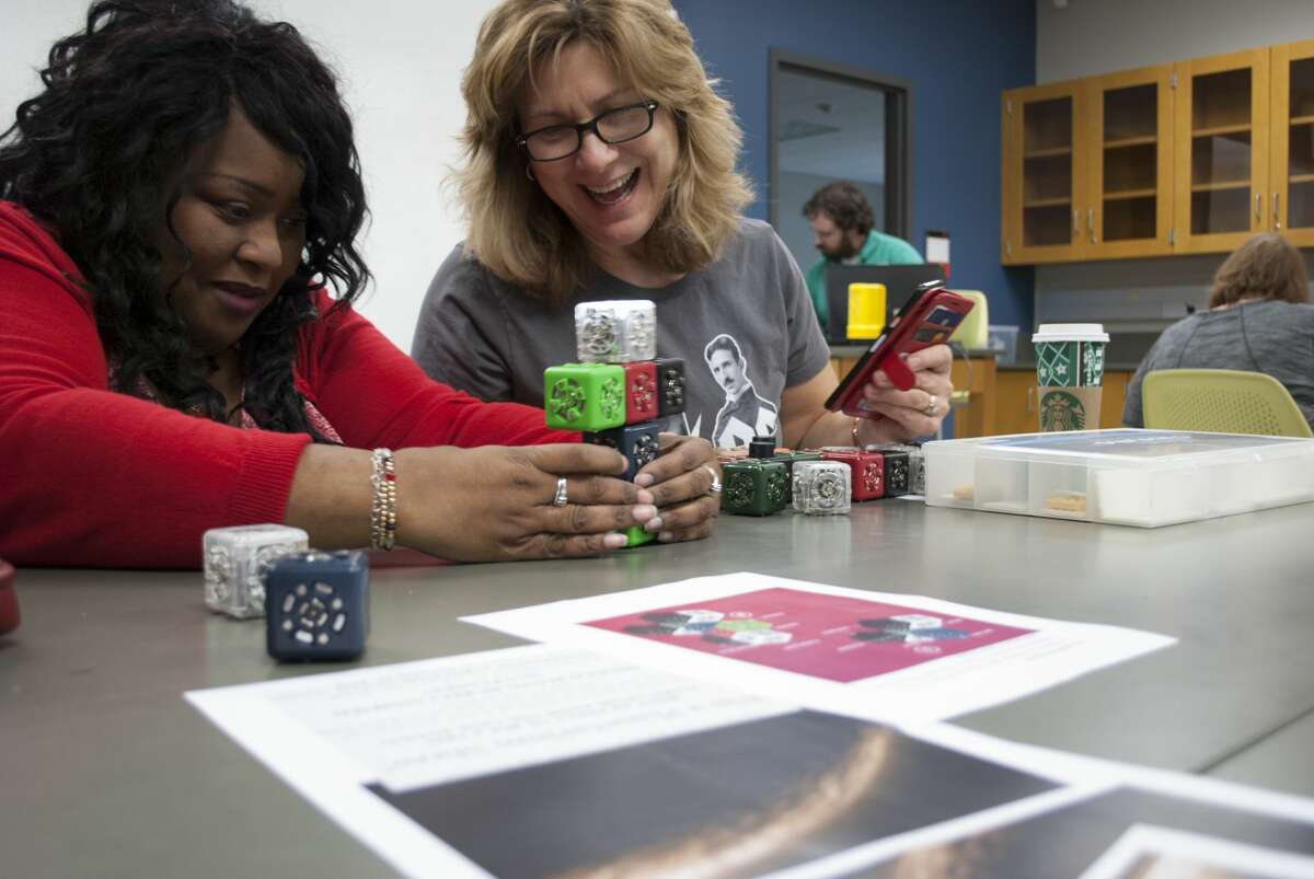 Teachers at a robotics professional development at the STEM Center at Southern Illinois University Edwardsville use Cubelets, which are available through the STEM Resource Center. Cubelets are a favorite of local teacher as it helps teach the basics of coding through magnetic cubes that do not require a computer to function.