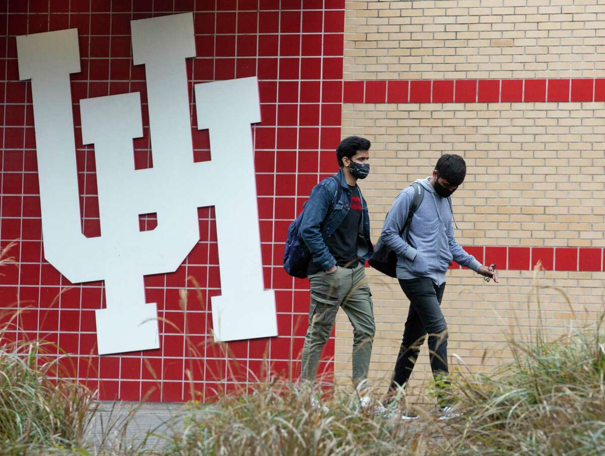 Students walk on the University of Houston campus Monday, Jan. 24, 2022, in Houston.