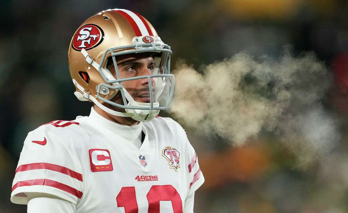 Despite a sprained shoulder and injured right thumb, Jimmy Garoppolo has helped lead the 49ers to two road playoff victories.