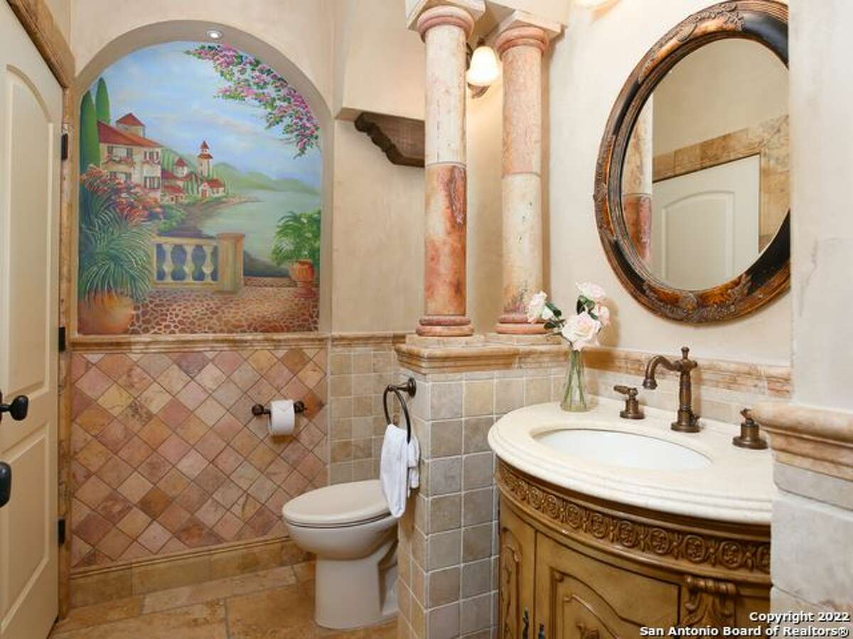 The home is complete with “exquisite ceiling detail” and “stunning hand-painted murals.” 