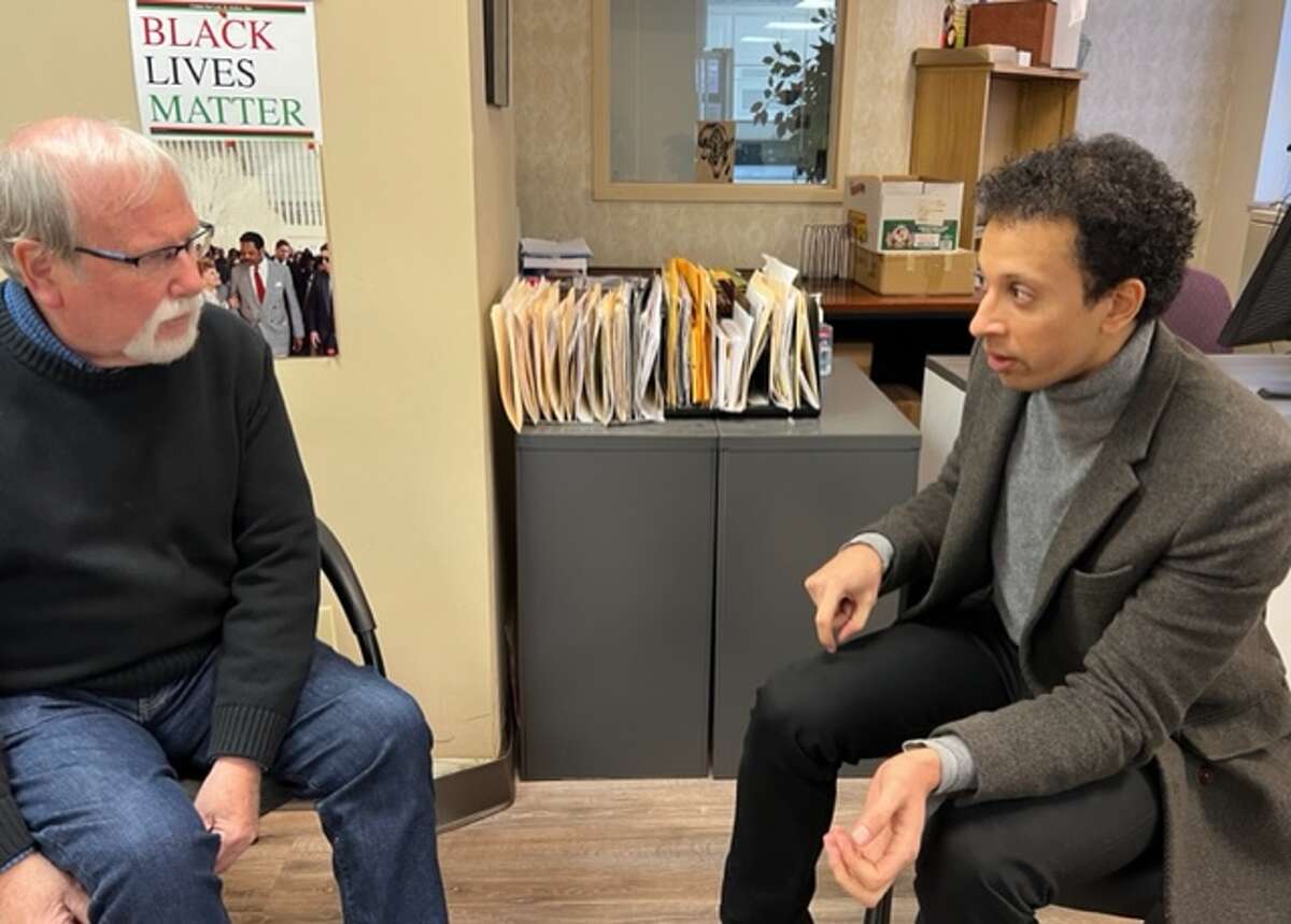 Bernie Mulligan, left, and Marco Flagg discuss strategies to help Albany, GA grass-roots efforts to counting voting restrictions against predominantly poor, Black voters.