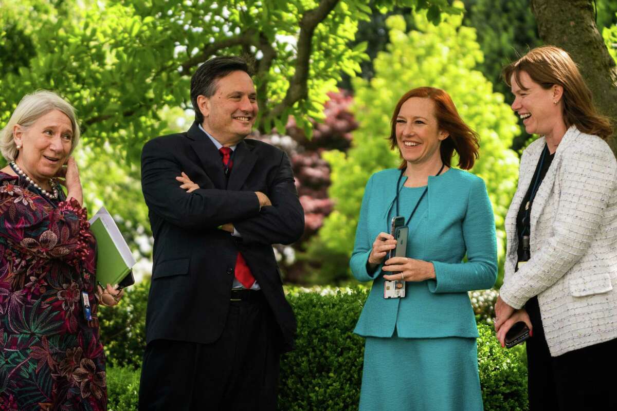 White House Chief of Staff Ron Klain talks with White House press secretary Jen Psaki, second from right, White House Communications Director Kate Bedingfield, right, and then-White House senior adviser Anita Dunn in the Rose Garden in May 2021 before remarks by President Biden.