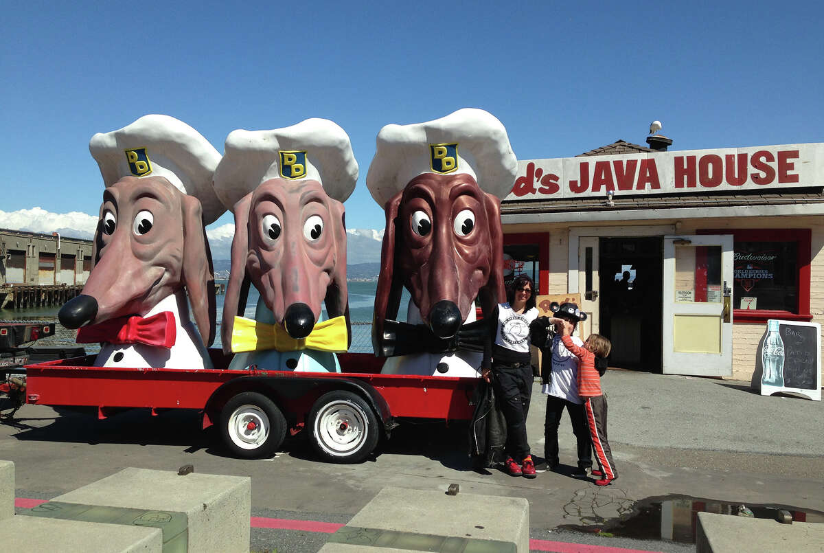 Doggie Diner heads at Red's Java House. Jennifer Holmes, Travis Holmes and Sebastian Law are pictured. 