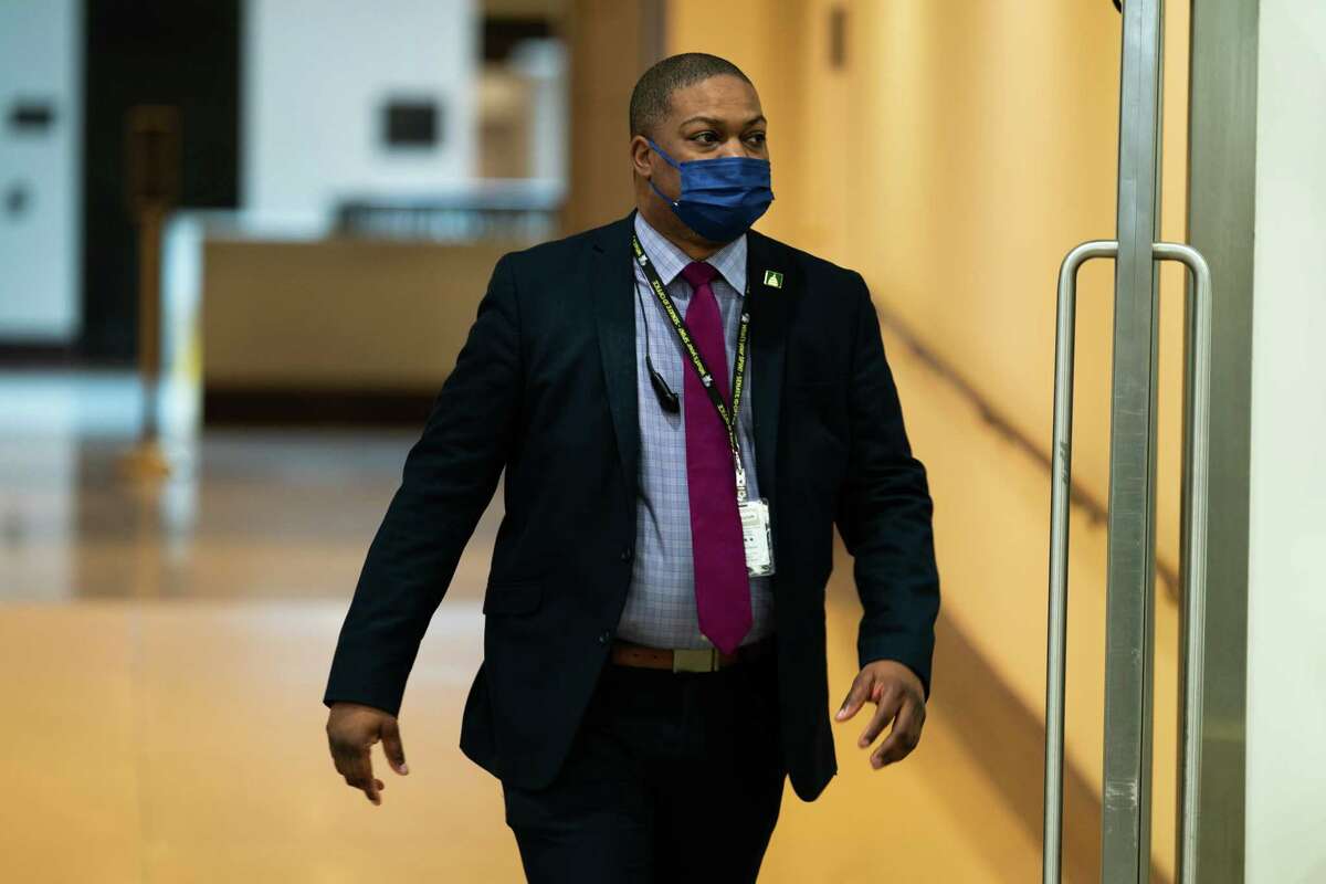 Capitol Police officer Eugene Goodman walks through a U.S. Capitol hallway during the fifth day of the impeachment trial of former President Donald Trump in February.