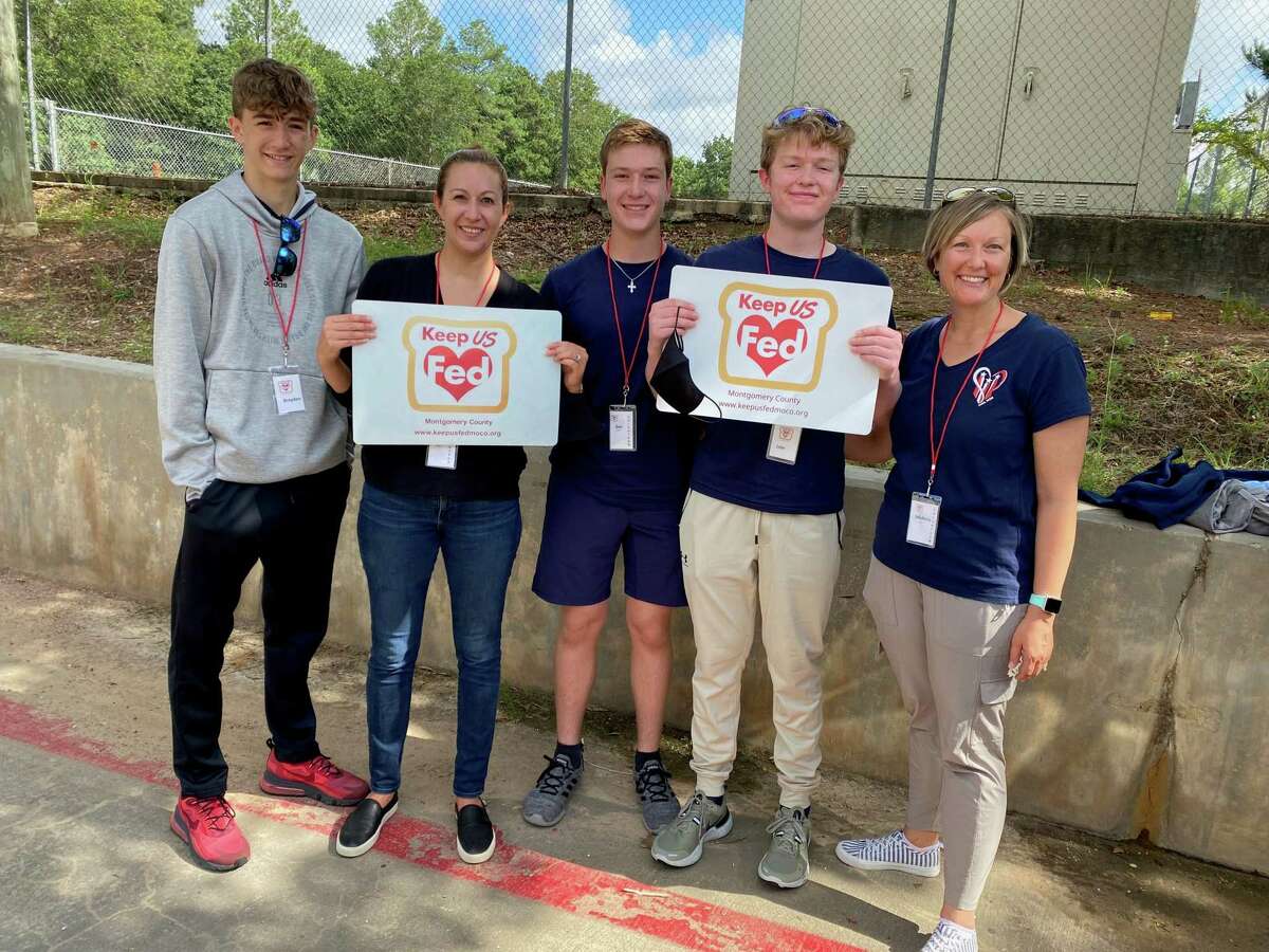 Members of the Young Men's Service League of The Woodlands Brayden Cole, left, First Vice President Aimee Cole, Gus Bickett, Jake Bickett and VP Membership Michele Bickett. The group has not even completed one full year of existence but has already logged over 1,400 volunteer hours.