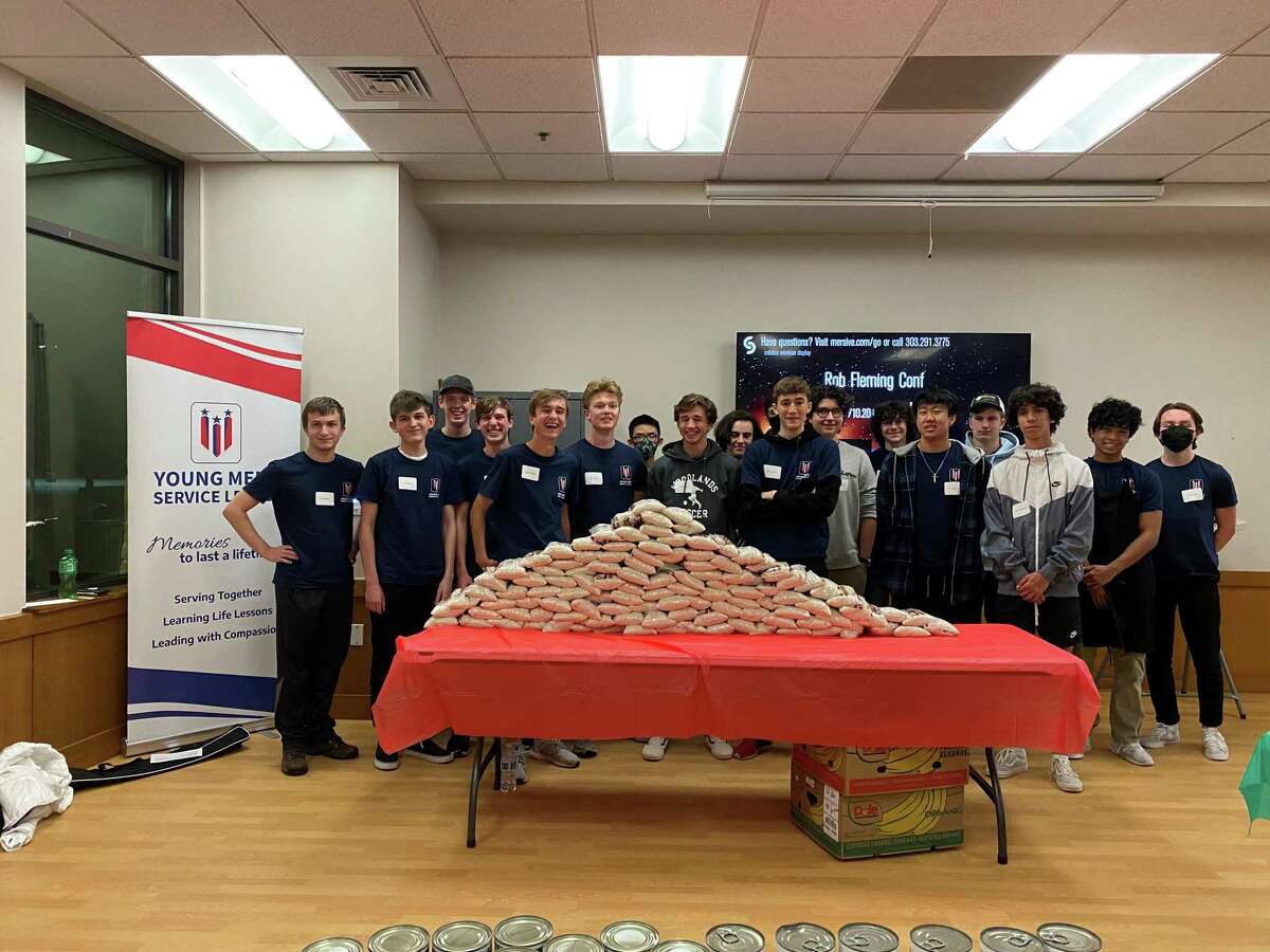 The 2022-2024 class of the Young Men's Service League of The Woodlands assembled holiday kits for the Abundant Harvest Kitchen at their November meeting that focused on philanthropy. The group has not even completed one full year of existence but has already logged over 1,400 volunteer hours.