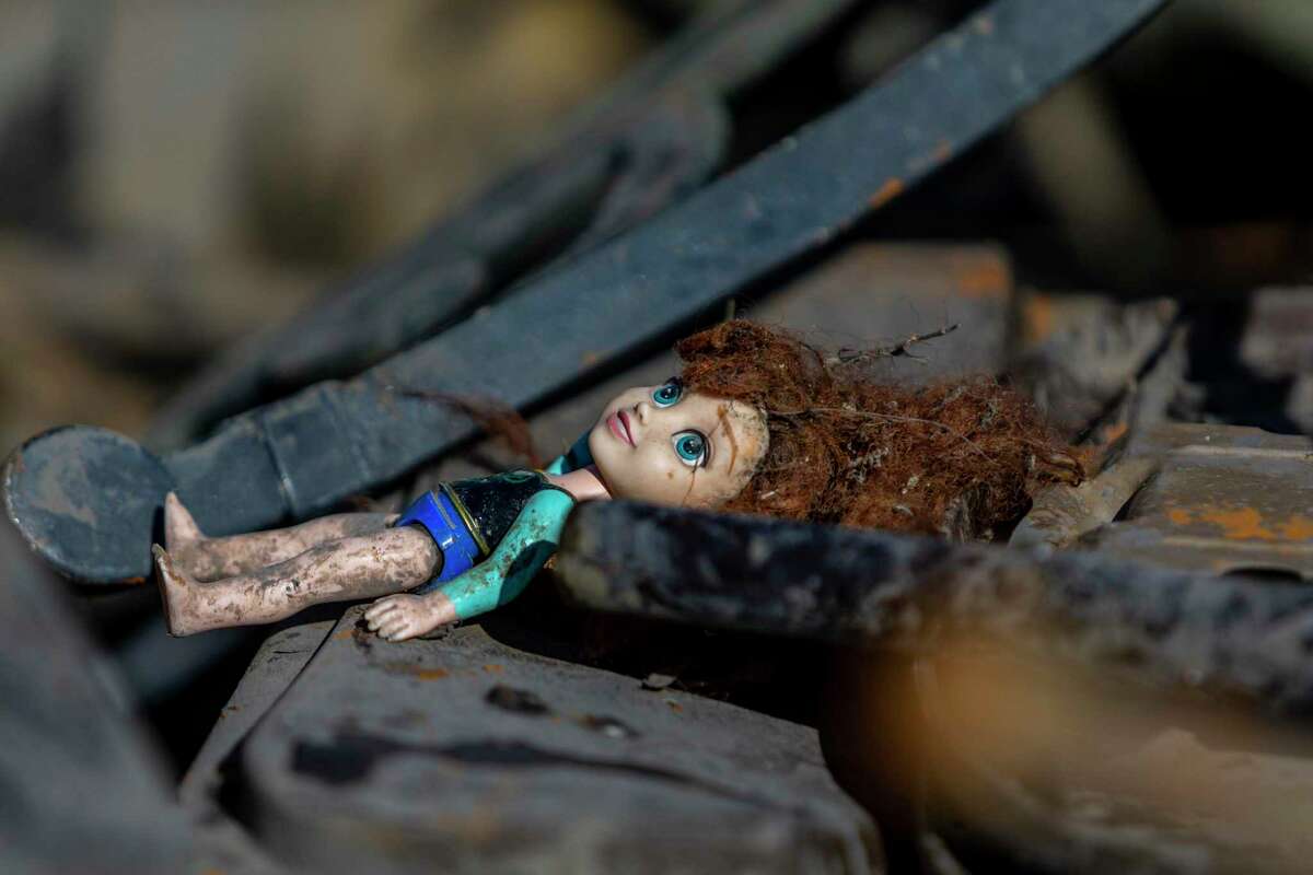 A doll found in the drained part of the San Antonio River along the River Walk sits Tuesday, Jan. 25, 2022, among other trash and debris found as the city of San Antonio and the San Antonio River Authority perform cleaning and maintenance on the downtown attraction.