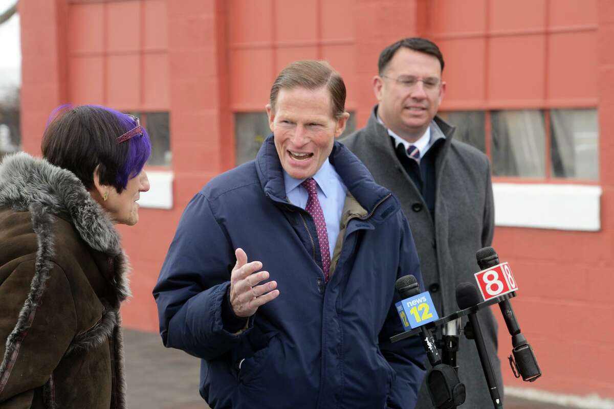 U.S. Sen. Richard Blumenthal speaks with U.S. Rep. Rosa DeLauro during a news conference at Lisman Landing, in Milford, Conn. Jan. 25, 2022. Joined here by Mayor Ben Blake, Blumenthal and DeLauro announced a $5 million federal grant to dredge Milford Harbor.