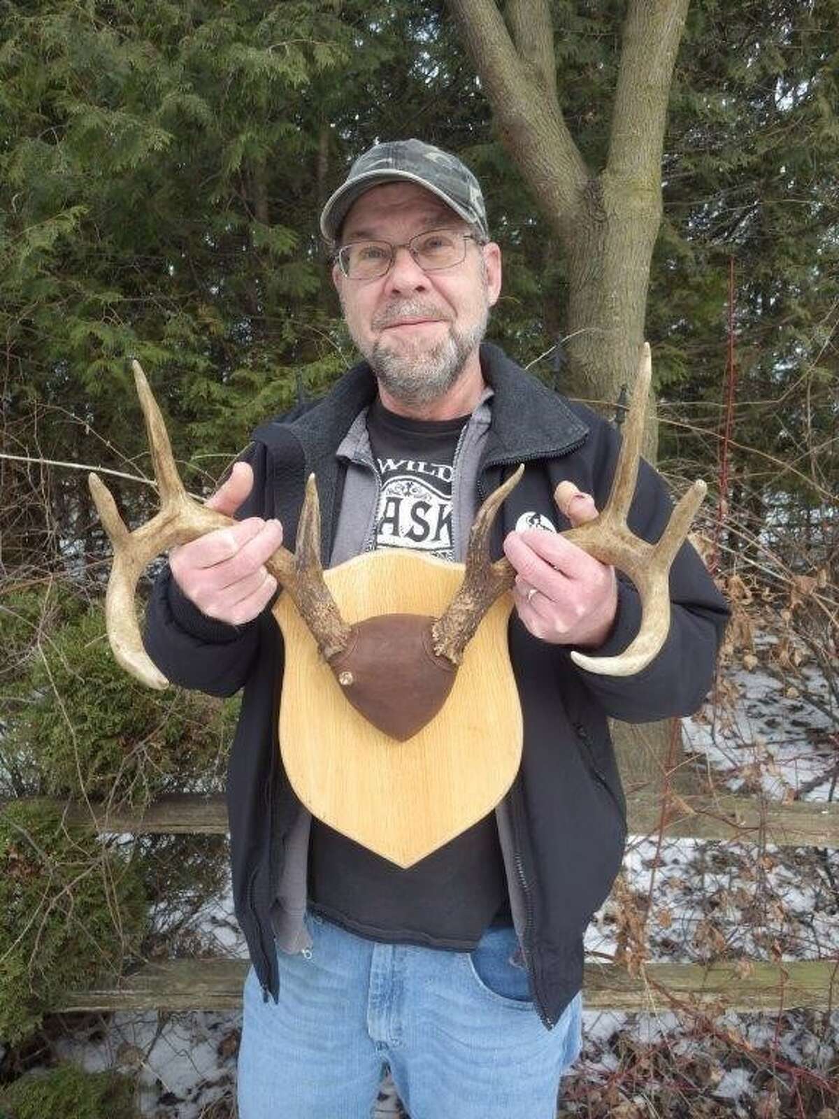 Tom Montgomery of Deford displays his unusual three-antlered, 4 1/2-year-old buck that he shot on his own personal "deer-patch" during the evening of the 2021firearms opener. The small third antler had been concealed by forehead hair until the taxidermist discovered it.