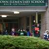 Students leave Coleytown Elementary School Thursday, February 13, 2020, in Westport, Conn.