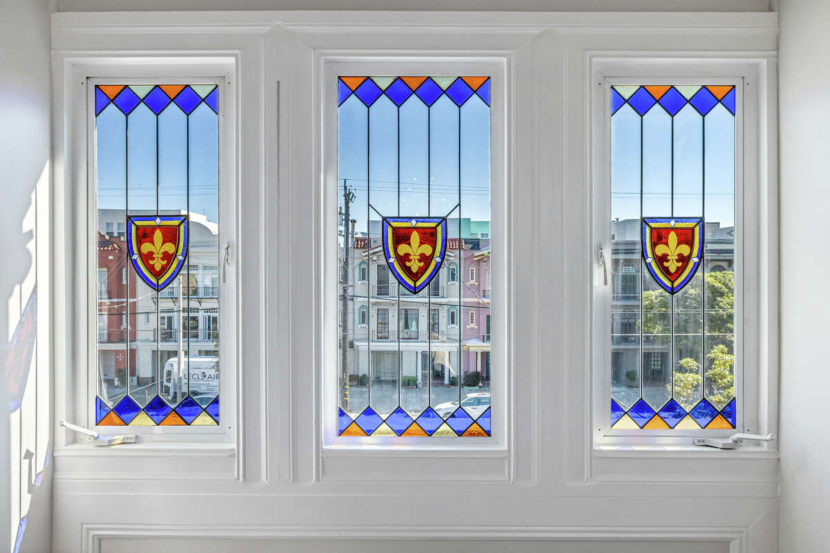 Preserved stained glass in the upper bedroom add artful neighborhood views.