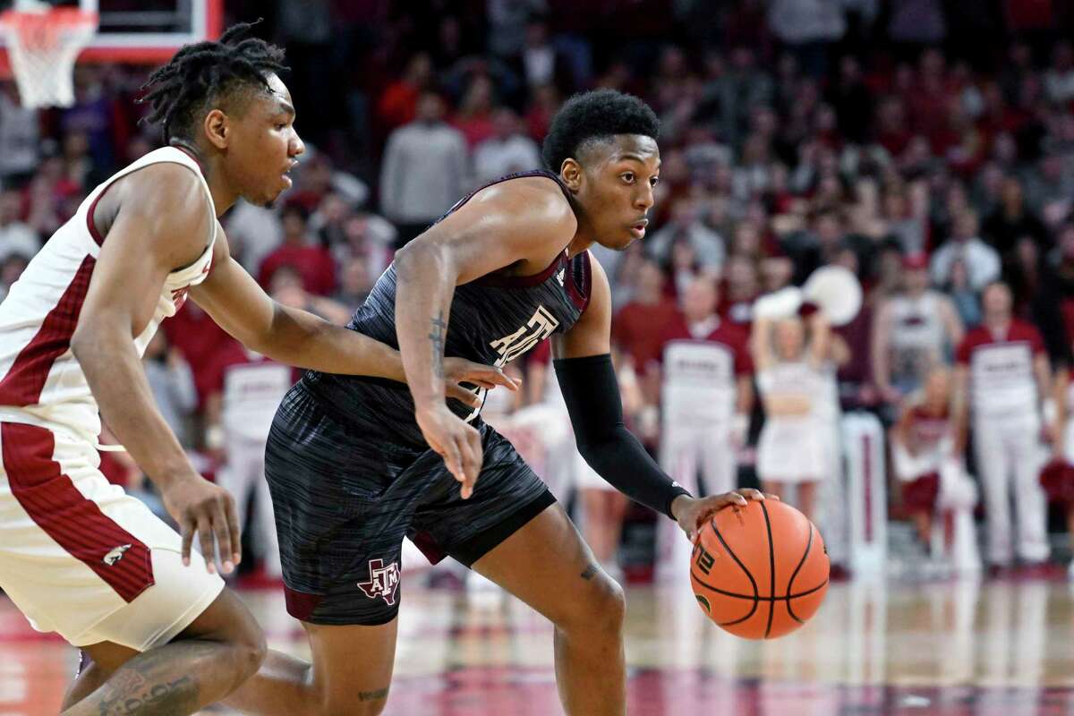 Guard Wade Taylor IV, right, scored a team-high 25 points at Arkansas on Saturday — the most by a Texas A&M freshman against an Southeastern Conference opponent since 2018.