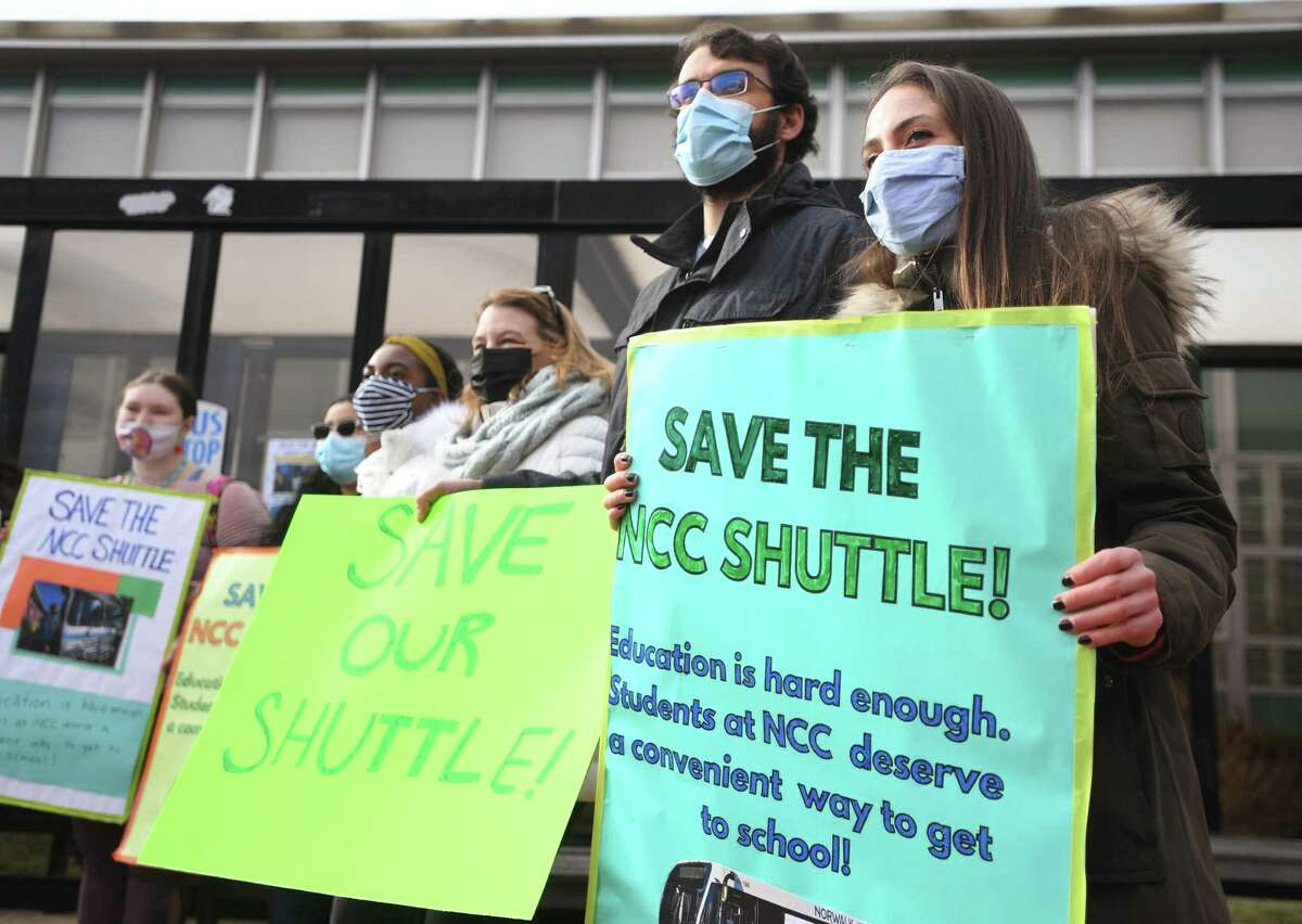 Students and faculty protest the loss of the NCC Shuttle, a bus running between the Metro North train station and the Norwalk Community College, at the school in Norwalk, Conn. on Tuesday, January 25, 2021. At right is student government President Lexi Kleinman, of Stamford.