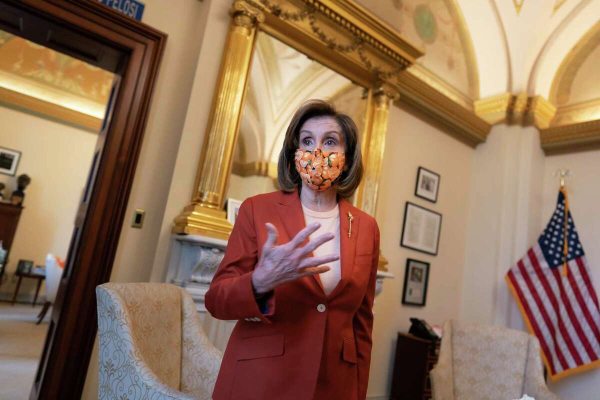 Speaker of the House Nancy Pelosi, D-Calif., talks to The Associated Press about the impact of the Jan. 6 attack by a mob loyal to then-President Donald Trump, during a tour of her office on Capitol Hill in Washington, Wednesday, Jan. 5, 2022. 