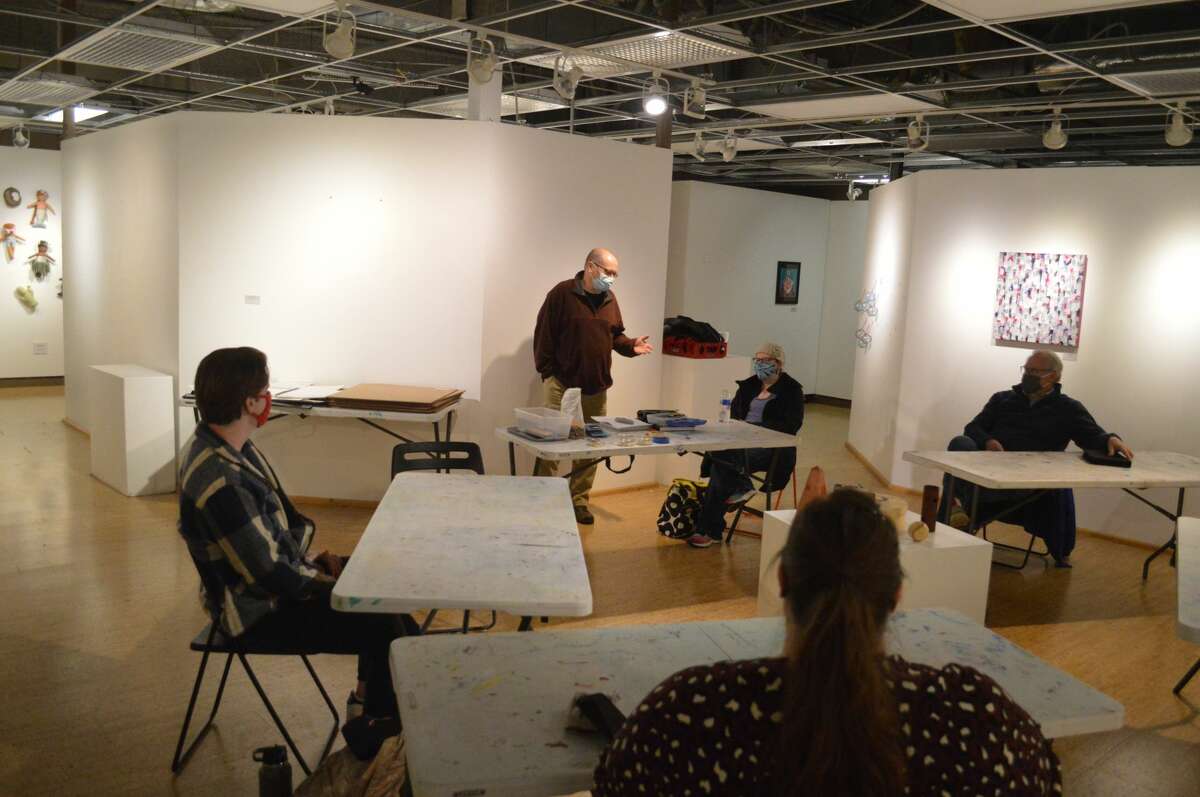 Jeffrey Nihiser, standing, a new gallery artist and instructor at the Edwardsville Arts Center, teaches his beginning drawing course, among many others, at the gallery. 