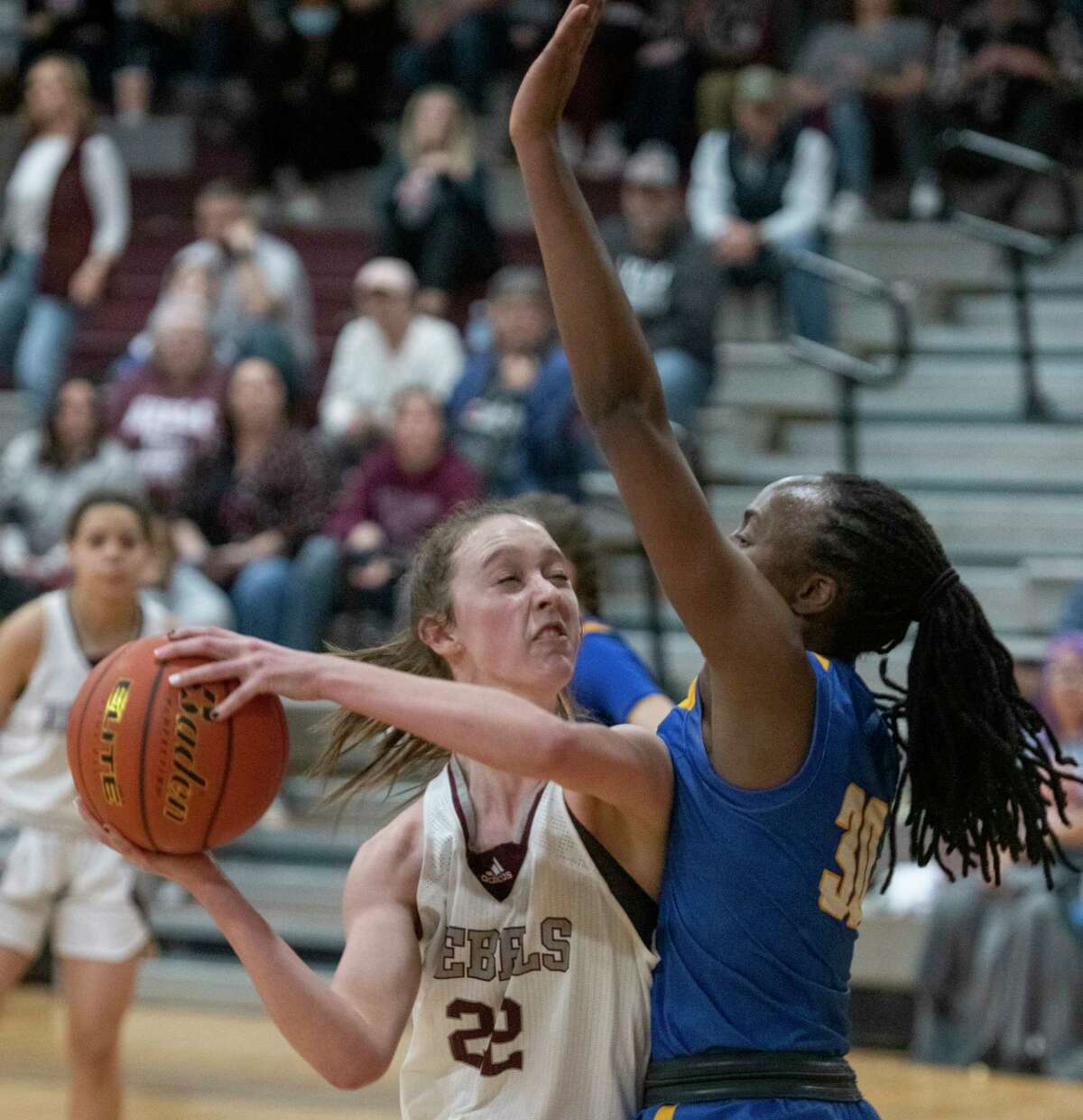 Legacy High's Maggie Erdwurm looks to make a shot as Frenship's Mikah Chapman defends 01/25/2022 the Legacy High gym. Tim Fischer/Reporter-Telegram